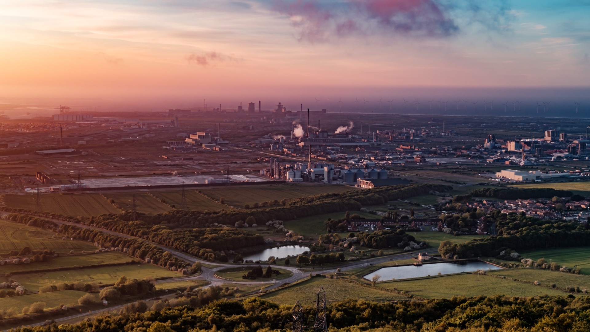 Aerial view of industrial landscape at sunset — East Coast Hydrogen facility region